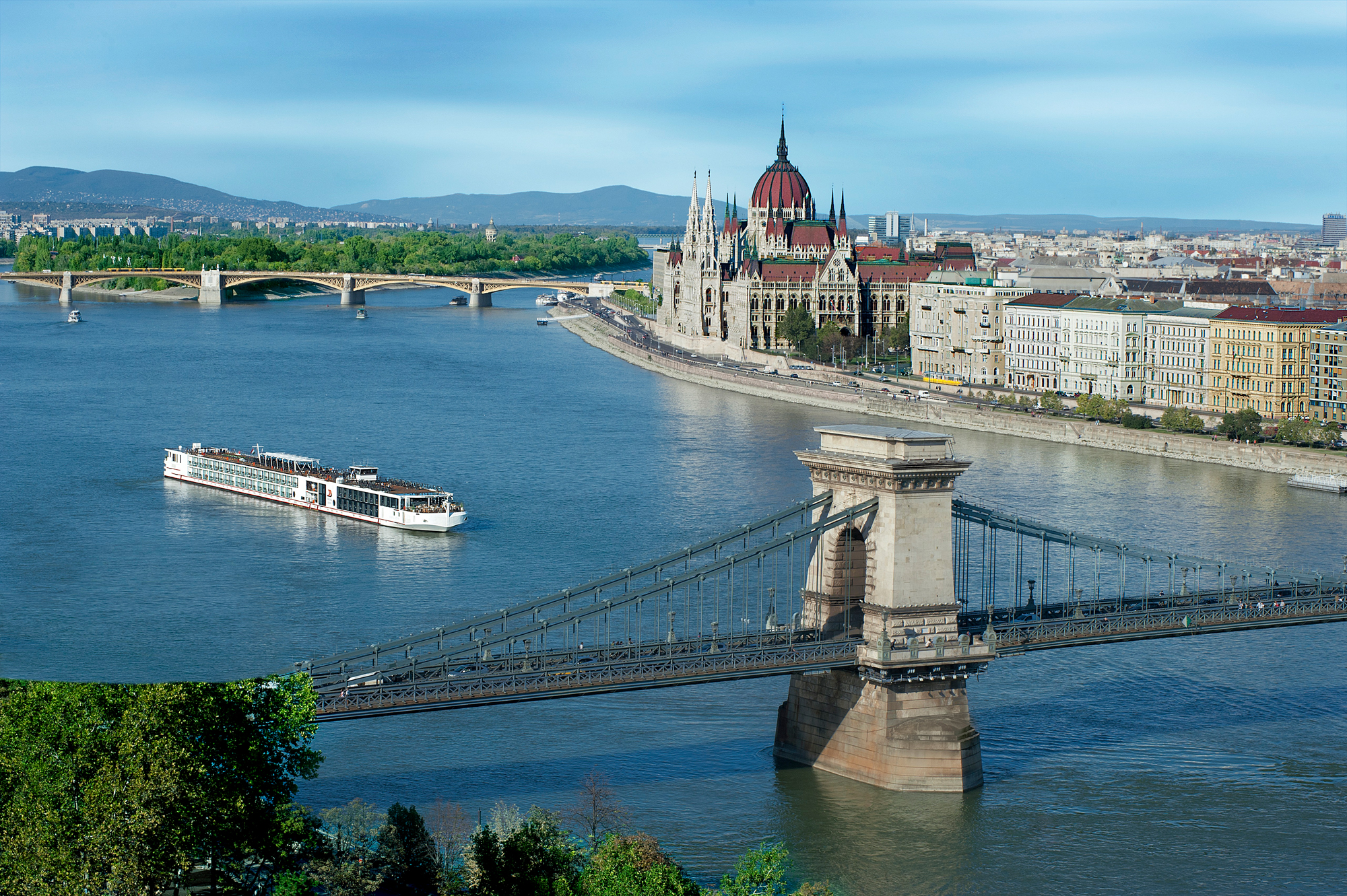 Budapest Panorama with Danube River A scenic view of Budapest showcasing the iconic Chain Bridge, the Hungarian Parliament Building