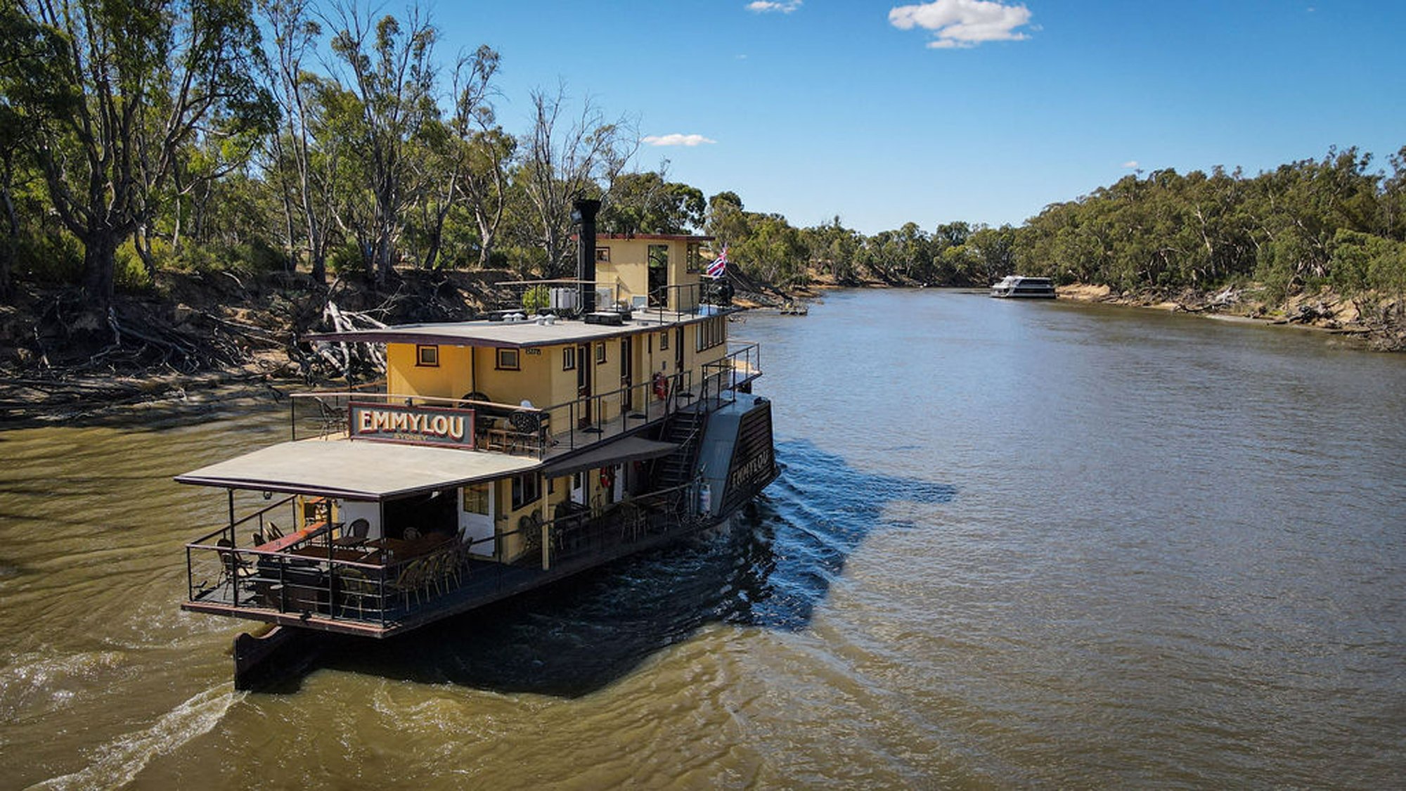 Emmylou Paddlewheel Riverboat on Murray River A traditional paddlewheel riverboat named Emmylou moored along the Murray River in Australia