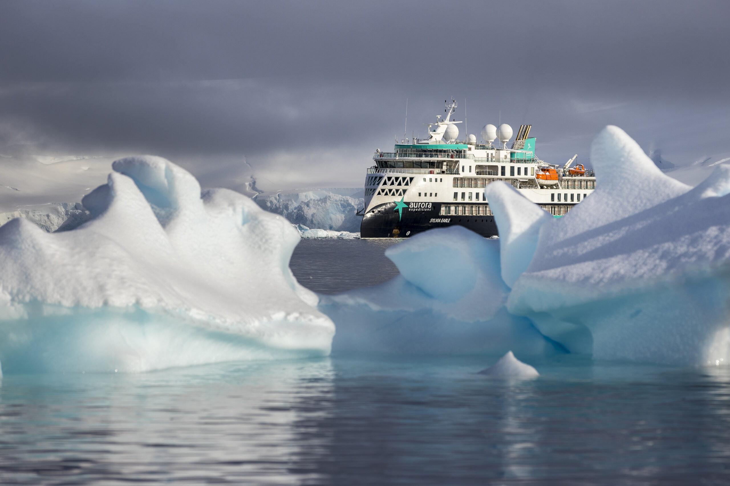 MV Sylvia Earle Among Antarctic Icebergs The expedition cruise ship MV Sylvia Earle navigates through a field of massive blue and white