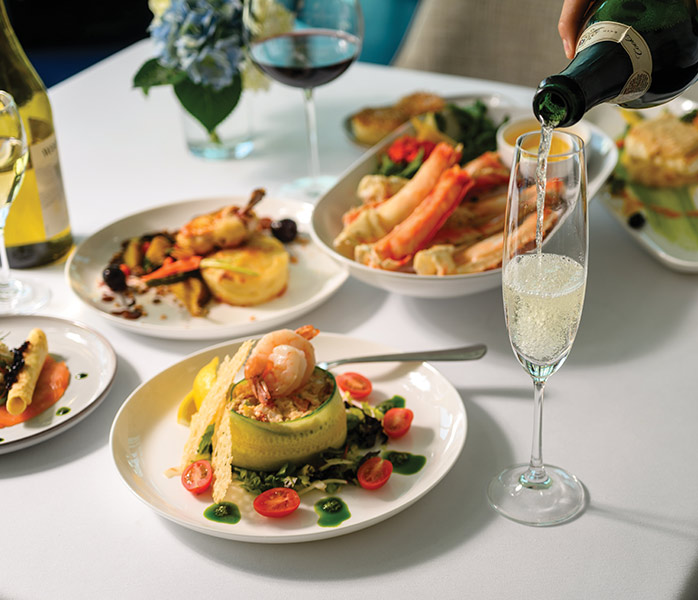Fine Dining Cuisine with Champagne Service An elegant multi-course dining experience featuring artfully plated seafood and vegetable dishes