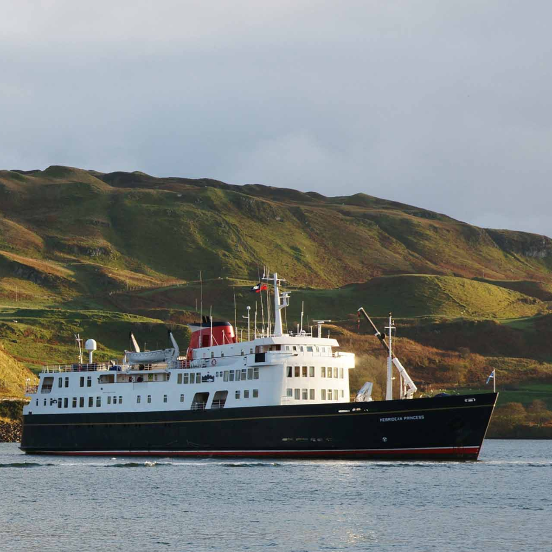 Hebridean Princess in Scottish Waters The Hebridean Princess, a small luxury expedition cruise ship, anchors in calm waters against
