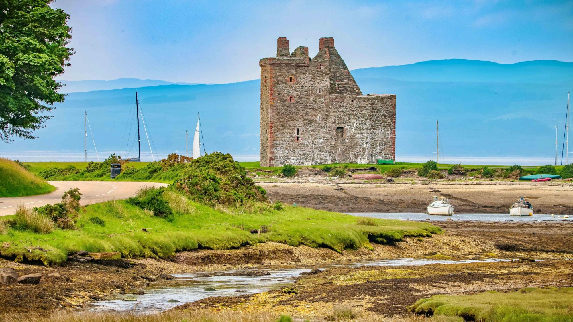 Lochranza Castle on Isle of Arran A picturesque ruined castle stands on the shores of Lochranza Bay on the Isle of Arran, Scotland