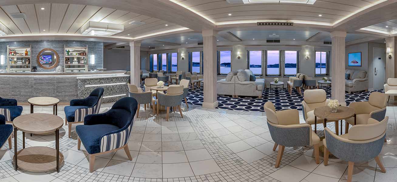 Luxury Cruise Ship Lounge with Ocean Views An elegant and spacious upper deck lounge aboard a modern cruise ship, featuring contemporary