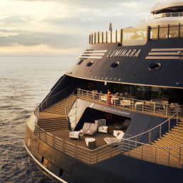 Modern Cruise Ship Terrace Deck at Sea A luxurious outdoor terrace area aboard a modern cruise ship, featuring elegant wooden decking