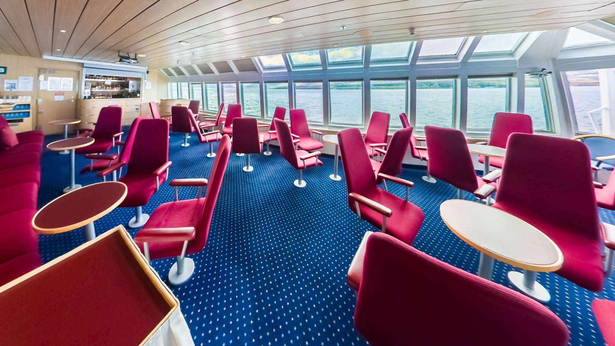 Ocean Nova 360° Panorama Lounge with Ocean Views A bright, modern panorama lounge aboard the Ocean Nova featuring expansive floor-to-ceiling windows