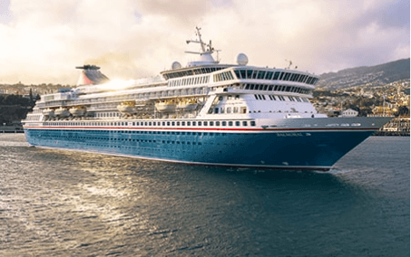 Luxury Cruise Ship in Mediterranean Port A large modern cruise ship with distinctive blue hull and white superstructure is anchored in