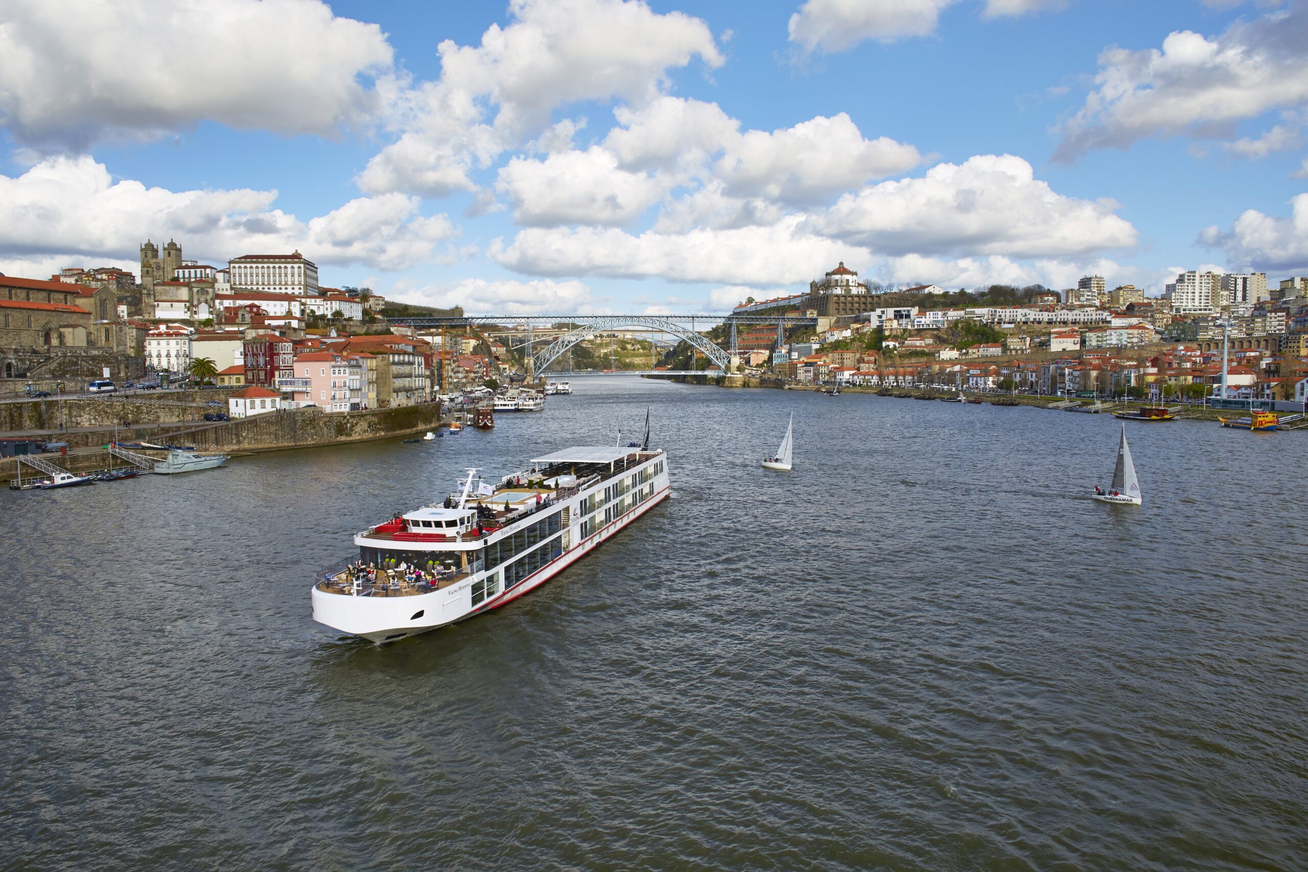 Viking River Cruise Ship in Porto A river cruise ship operated by Viking River Cruises navigates the Douro River in Porto, Portugal