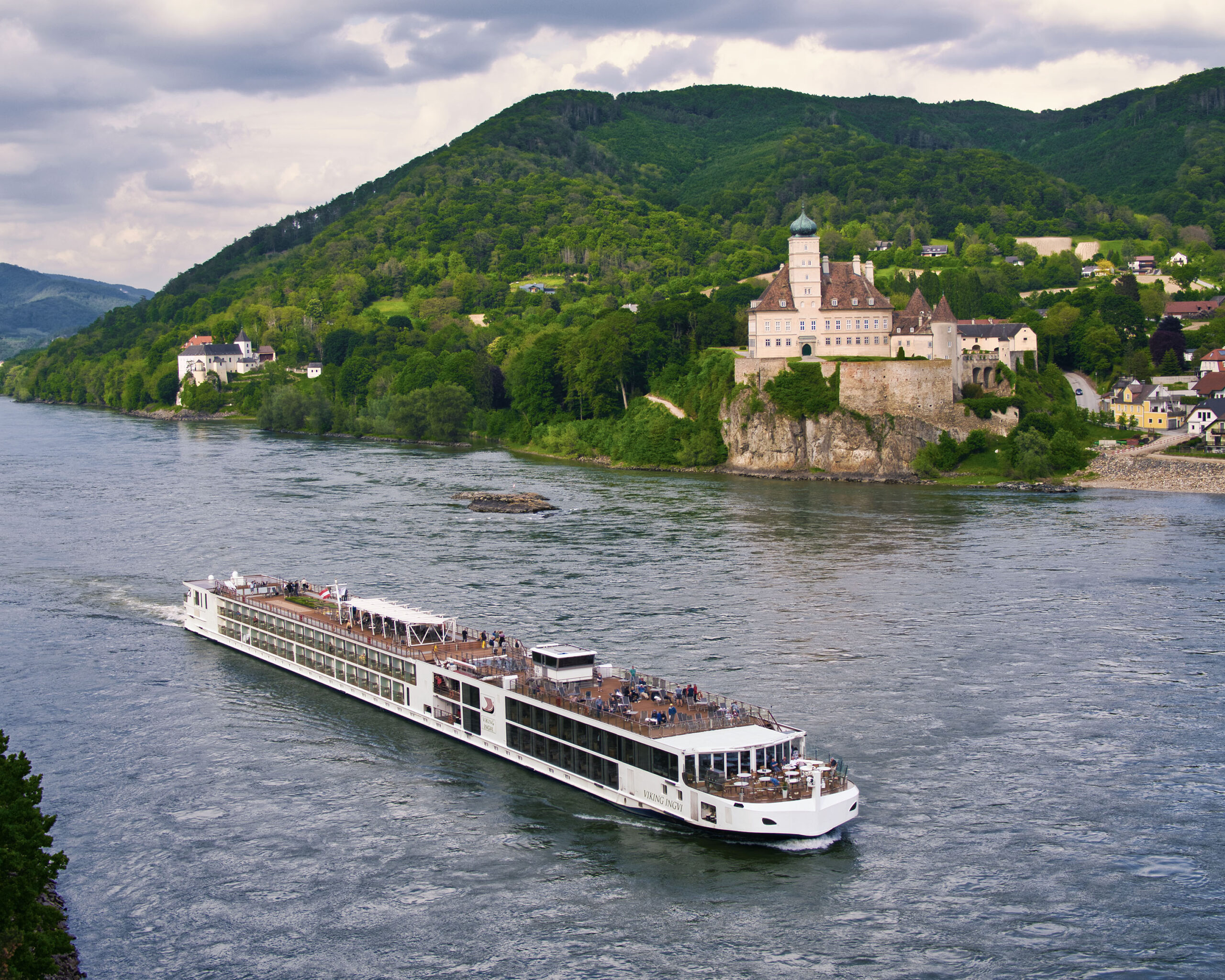 Viking Longships River Cruise at Schönbühel Castle A Viking Longships river cruise vessel navigates the Danube River past Schönbühel Castle
