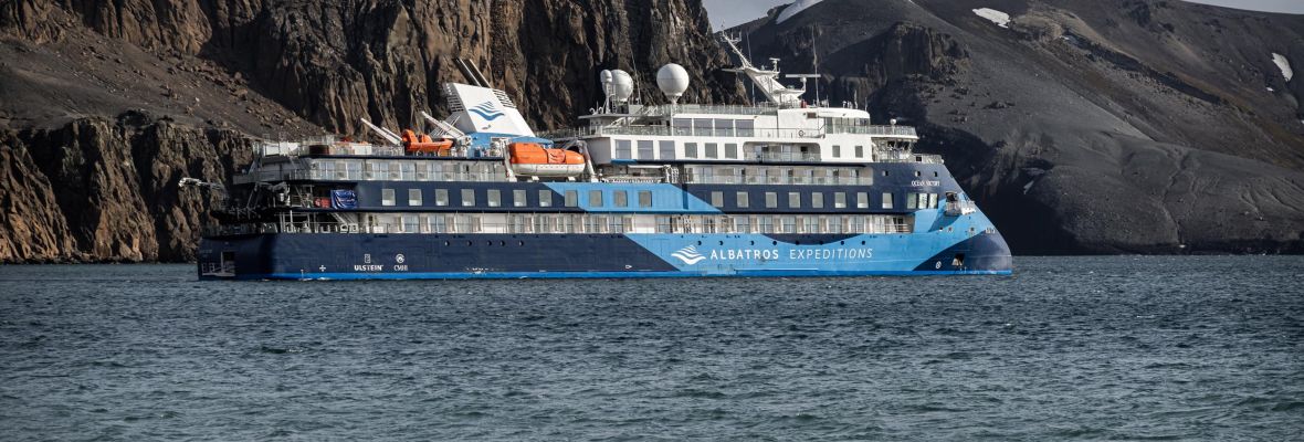 Ocean Victory Expedition Ship at Deception Island, Antarctica The Albatros Expeditions vessel Ocean Victory is anchored off the dramatic volcanic cliffs