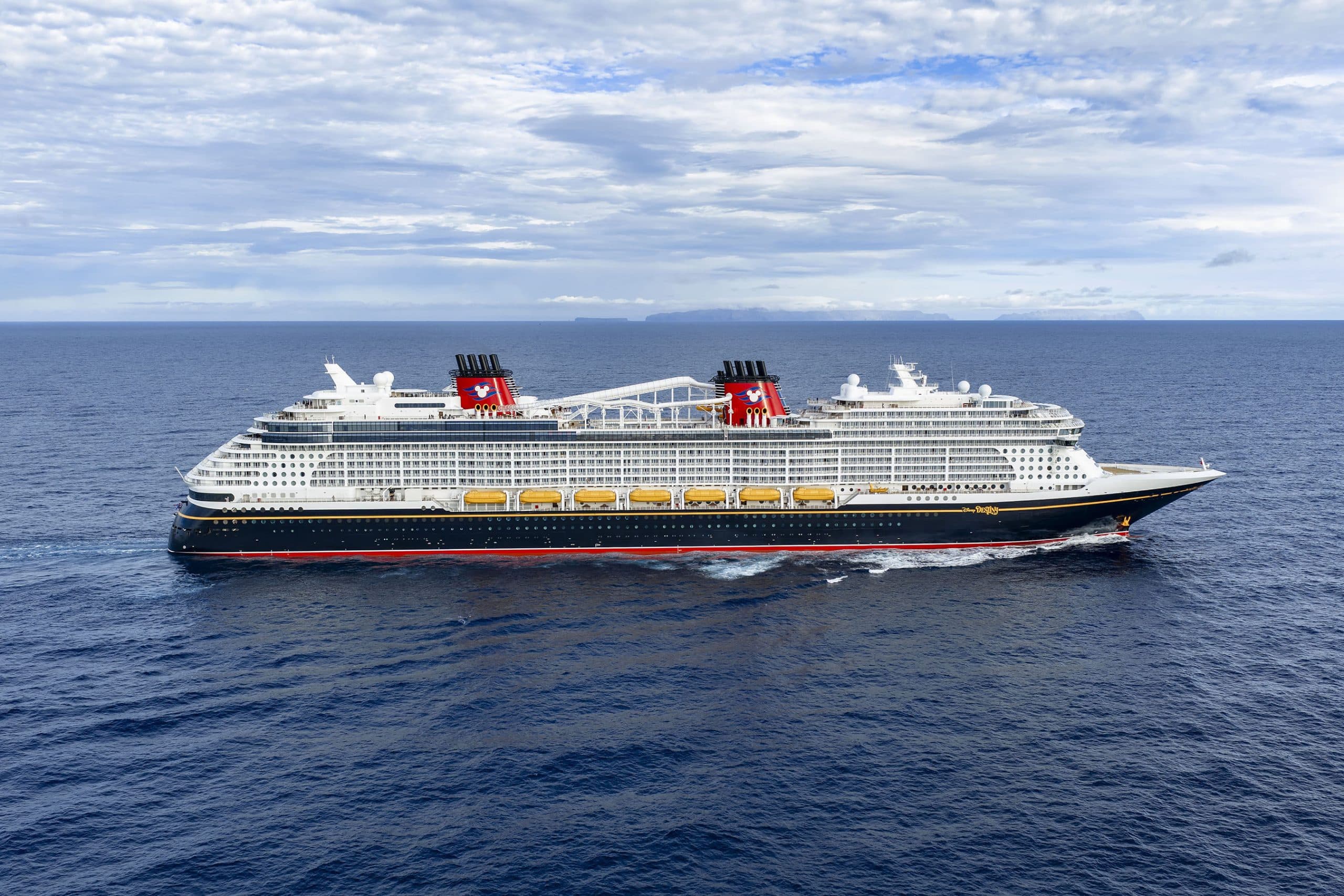 Disney Cruise Line Ship at Sea A massive Disney Cruise Line vessel photographed from an aerial perspective sailing through calm