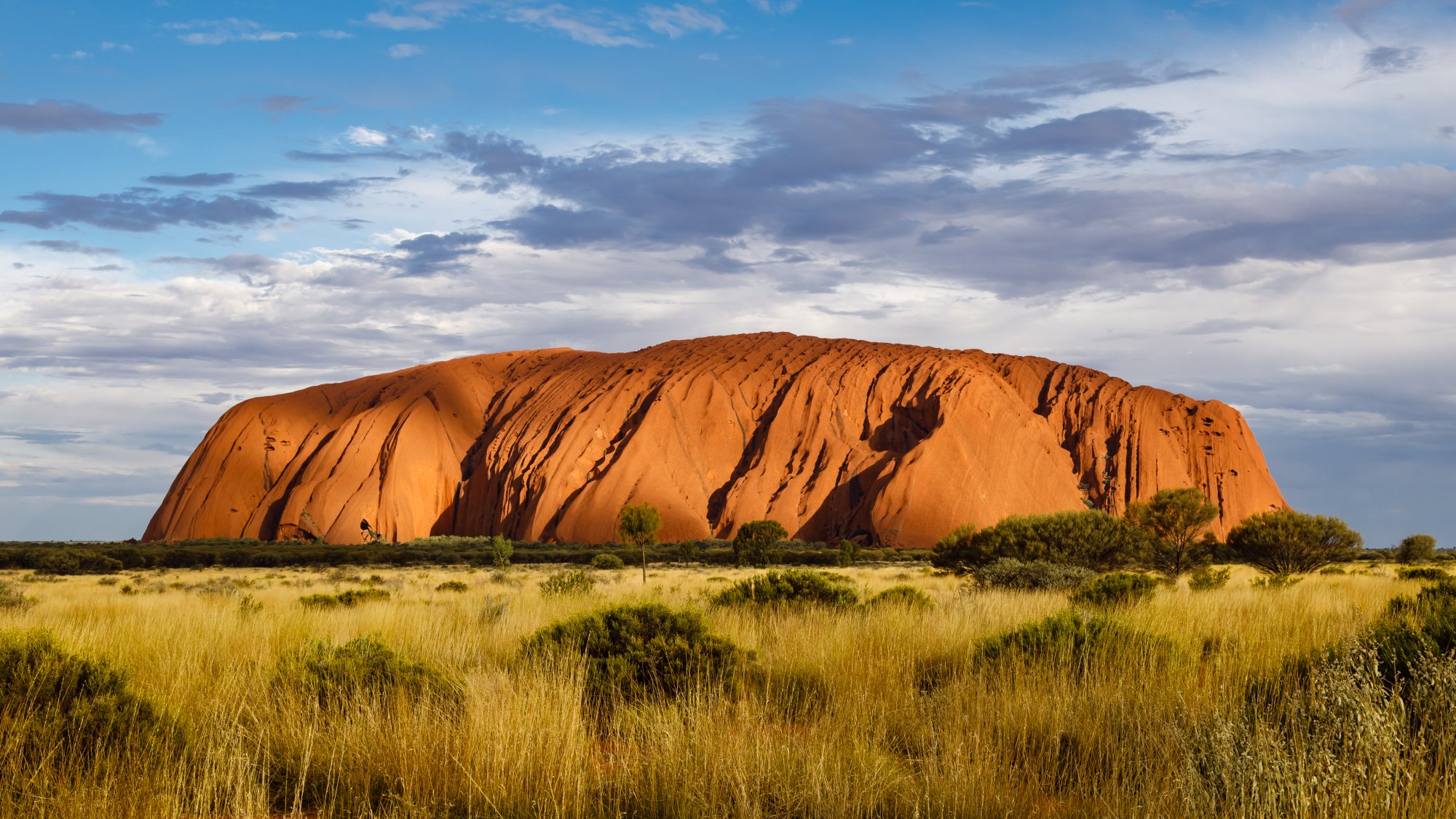 Uluru at Sunset in Australian Outback A striking view of Uluru (Ayers Rock), the iconic massive sandstone monolith in central Australia's