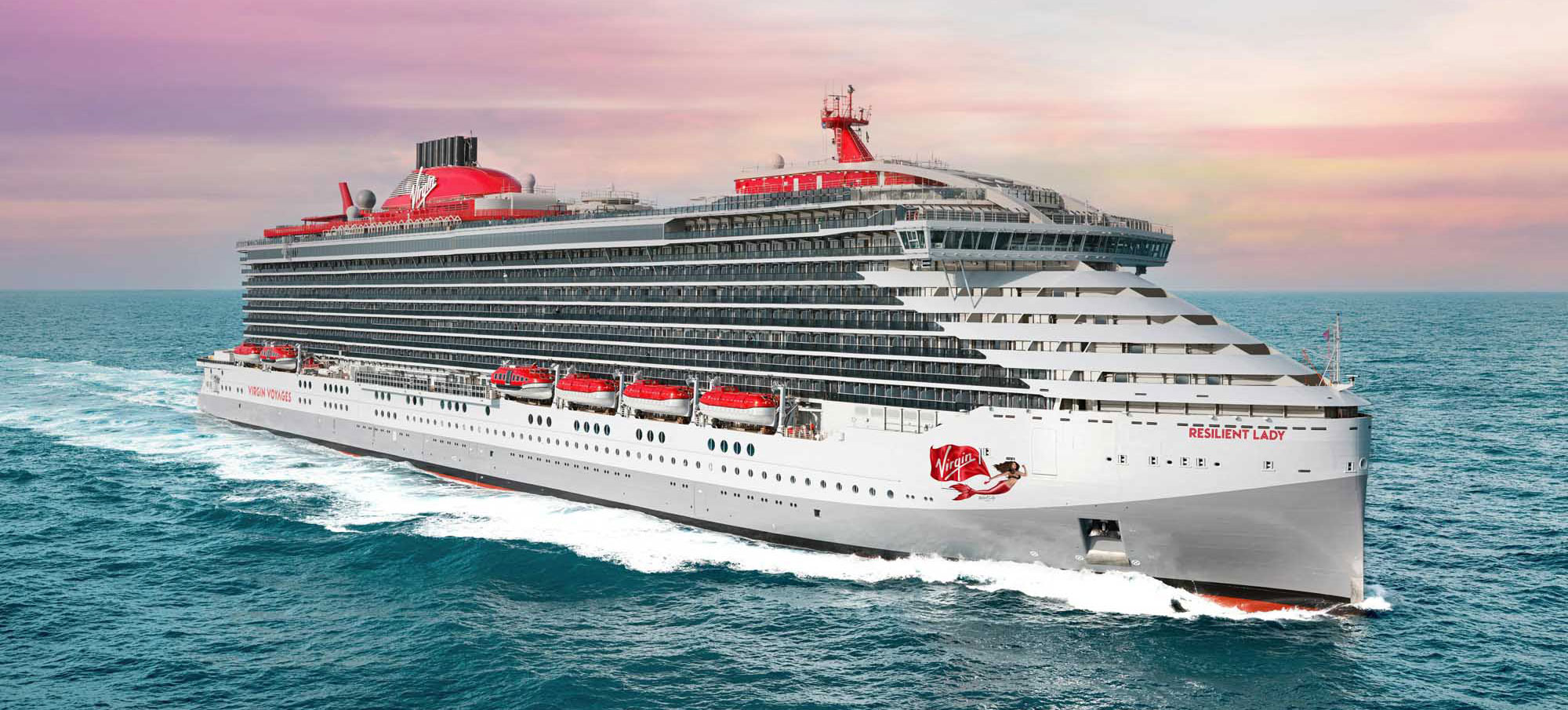 Virgin Resilient Lady cruise ship with red funnel sailing on turquoise ocean at sunset