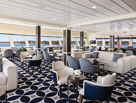 A sophisticated lounge area aboard an American Cruise Lines vessel featuring contemporary