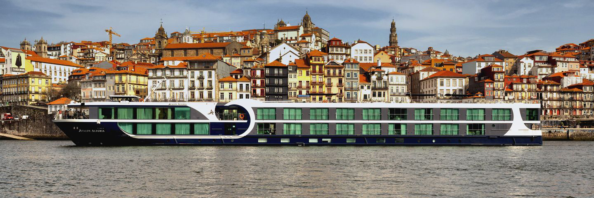 Avalon Alegria River Cruise Ship in Porto The Avalon Alegria, a modern river cruise ship with distinctive green-windowed upper decks
