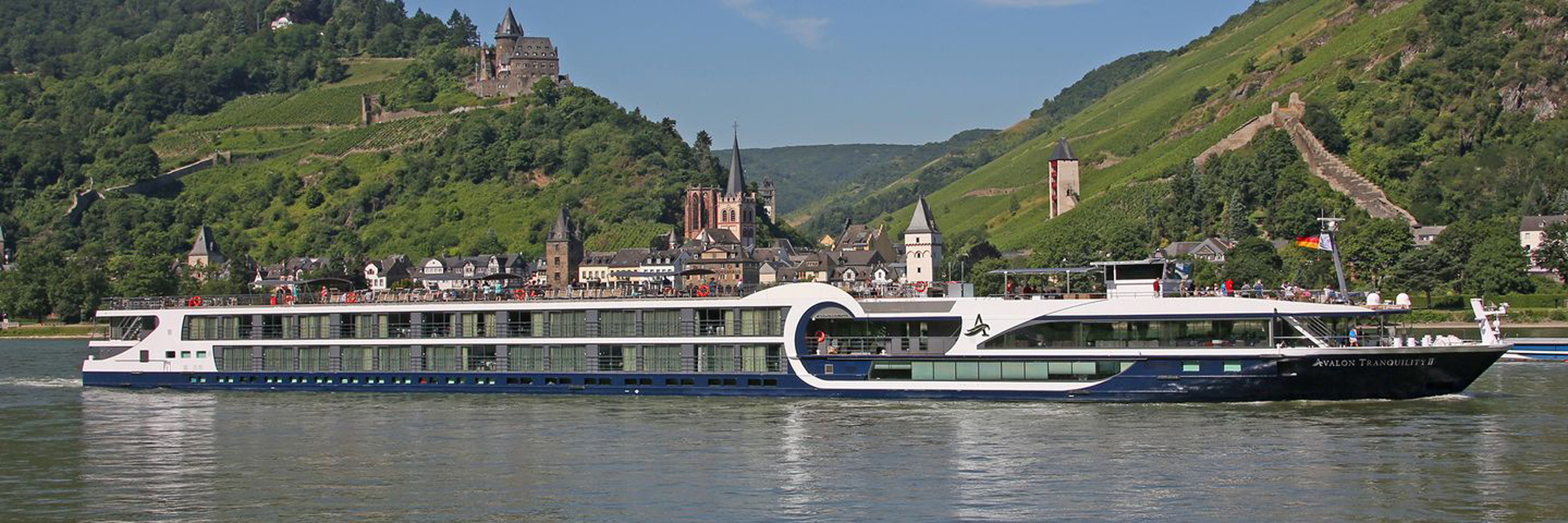 Avalon Tranquility II on Rhine River Near Cochem A modern river cruise ship, the Avalon Tranquility II, sails along the Rhine River with