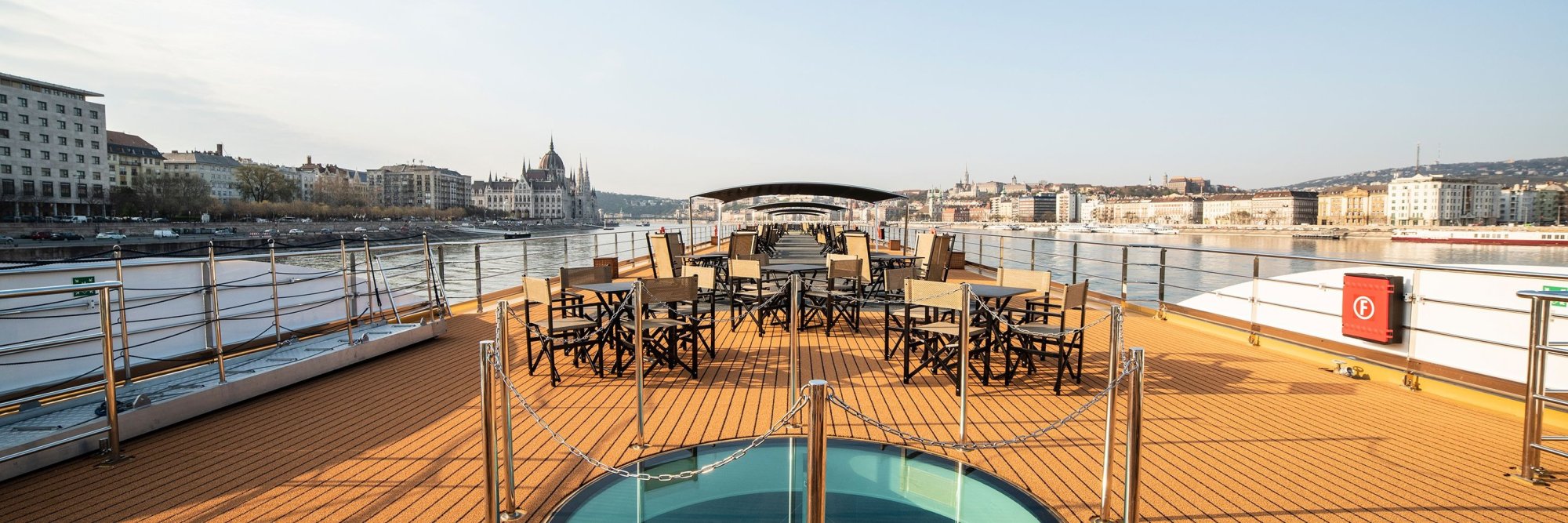Avalon Waterways River Cruise Deck in Budapest An elegantly appointed upper deck of an Avalon Waterways river cruise ship, featuring comfortable