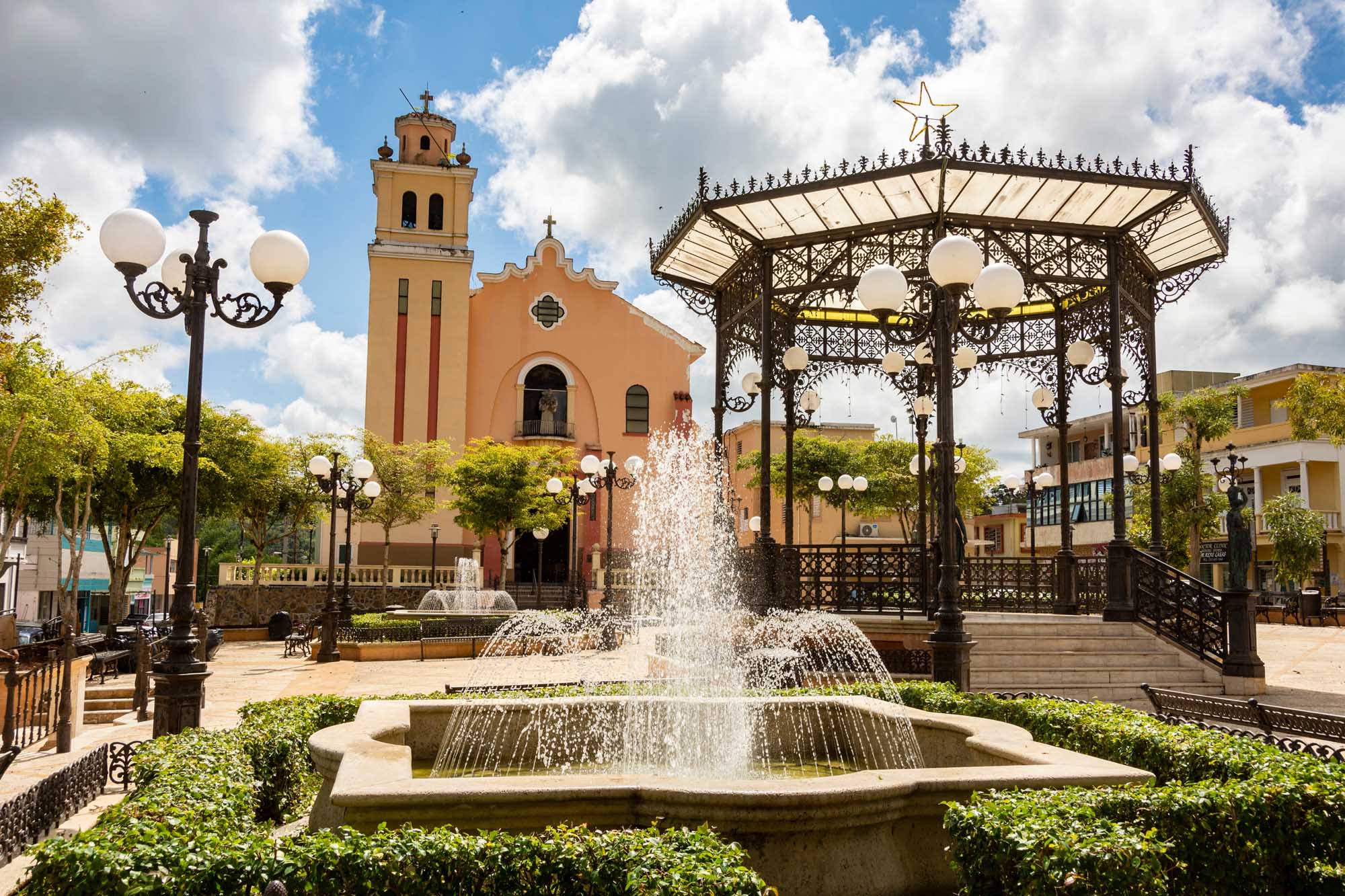 Barranquitas Town Square and Church of San Antonio de Padua A picturesque colonial-style town square in Barranquitas, Puerto Rico, featuring an ornate orange