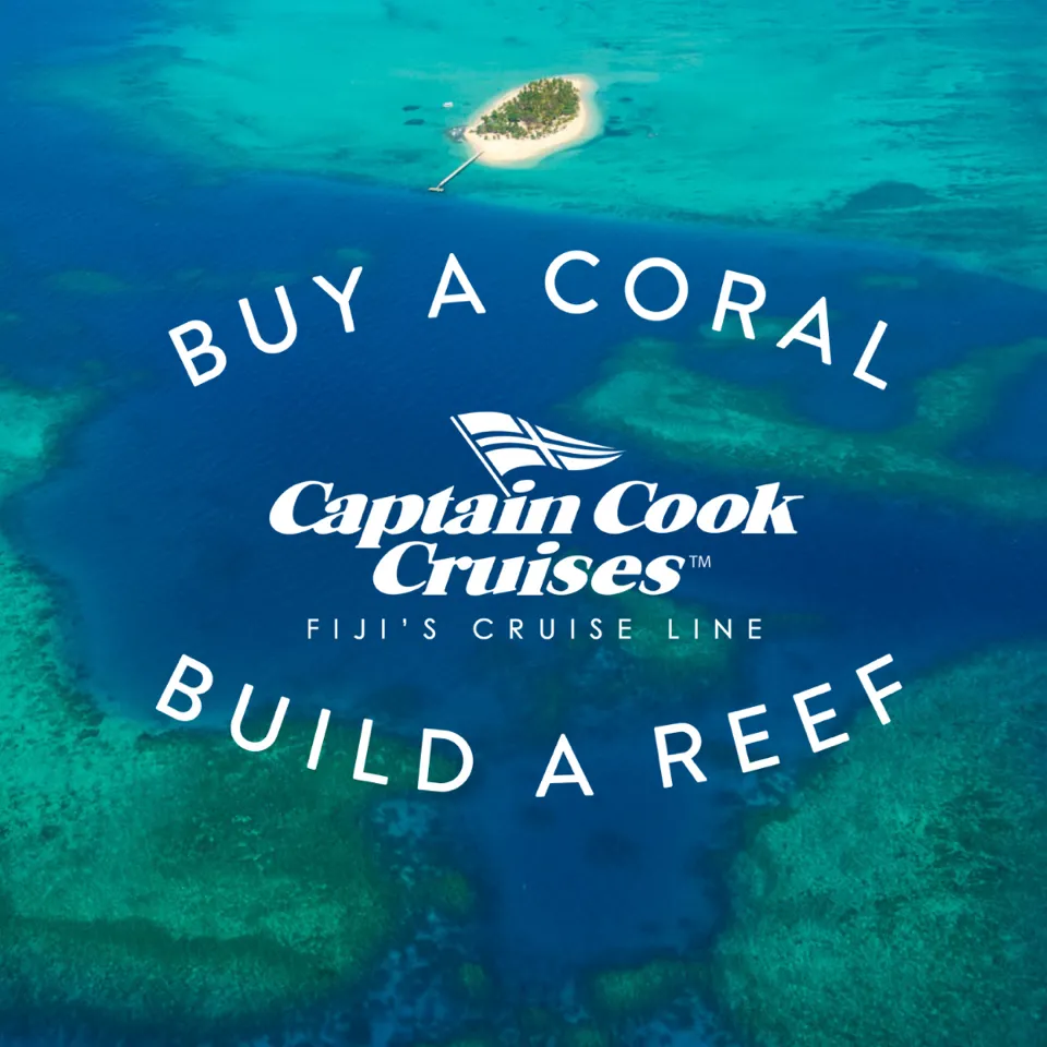 Captain Cook Cruises Fiji Coral Conservation Campaign An aerial view of a pristine tropical island surrounded by turquoise waters with an overlay
