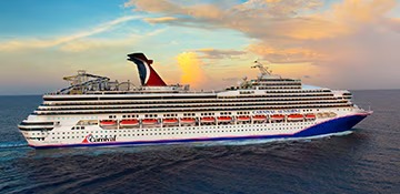 Carnival Sunshine Cruise Ship at Sunset A large modern cruise ship with distinctive black funnel and white hull sails through calm ocean