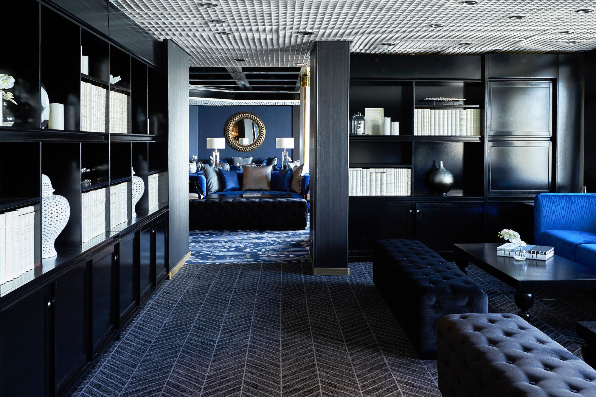 Celestyal Cruises Luxury Lounge with Blue Accents An elegantly designed modern lounge aboard a Celestyal Cruises vessel, featuring sophisticated