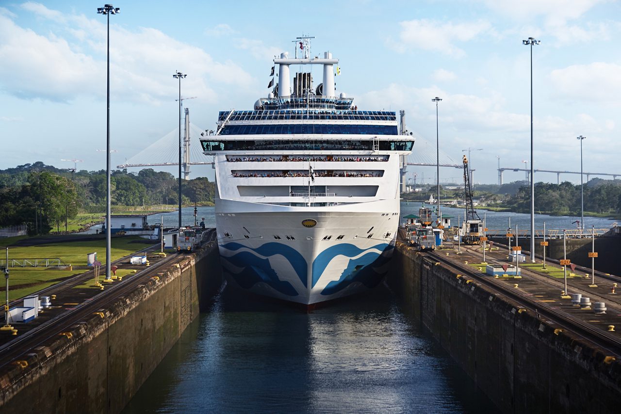 Coral Princess Transiting Panama Canal Locks A massive cruise ship, the Coral Princess, positioned head-on in the Panama Canal locks, showcasing