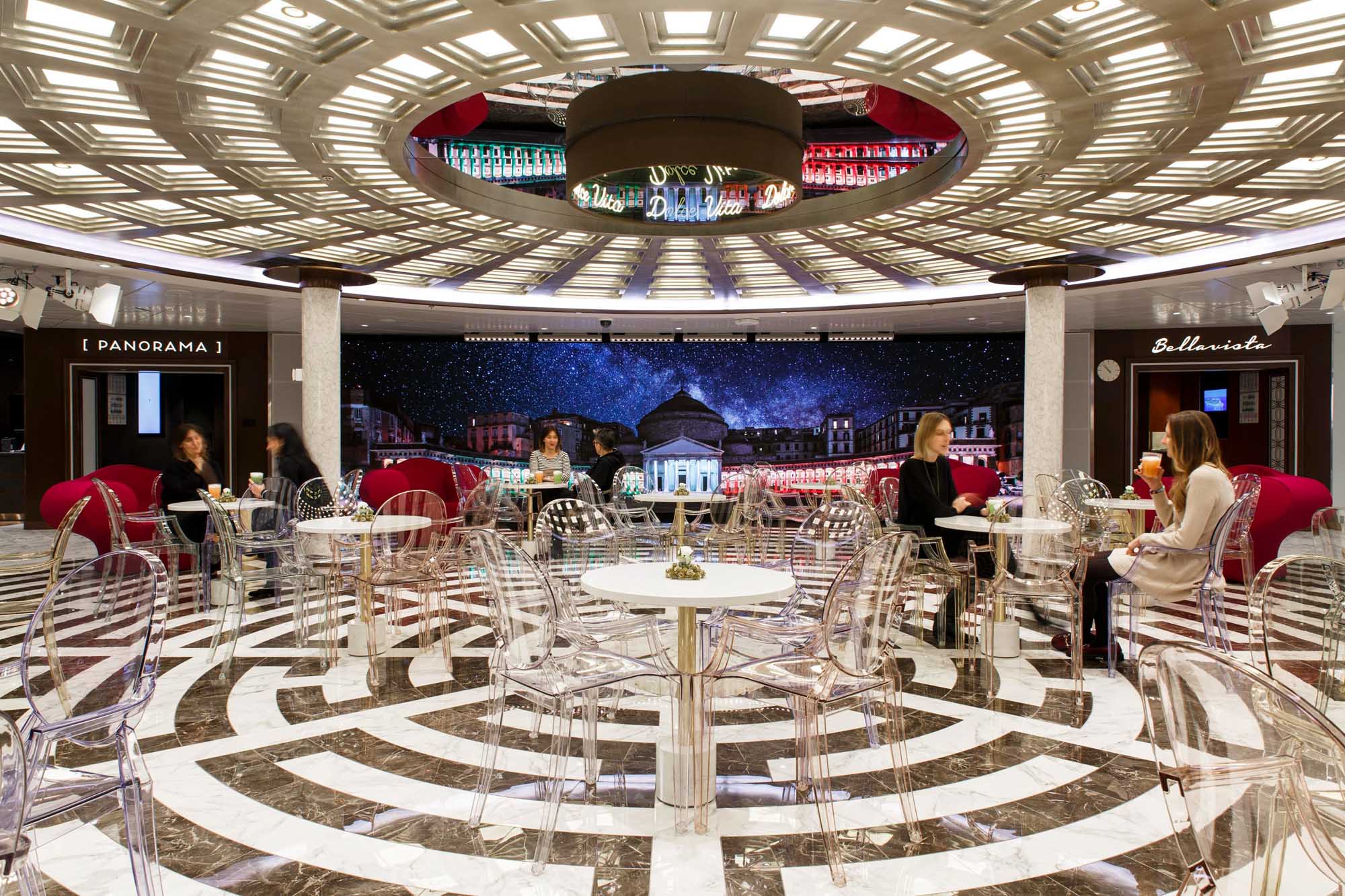 Elegant Bellaviota Café with Starlit Panorama A sophisticated indoor café featuring transparent modern chairs arranged around white tables on
