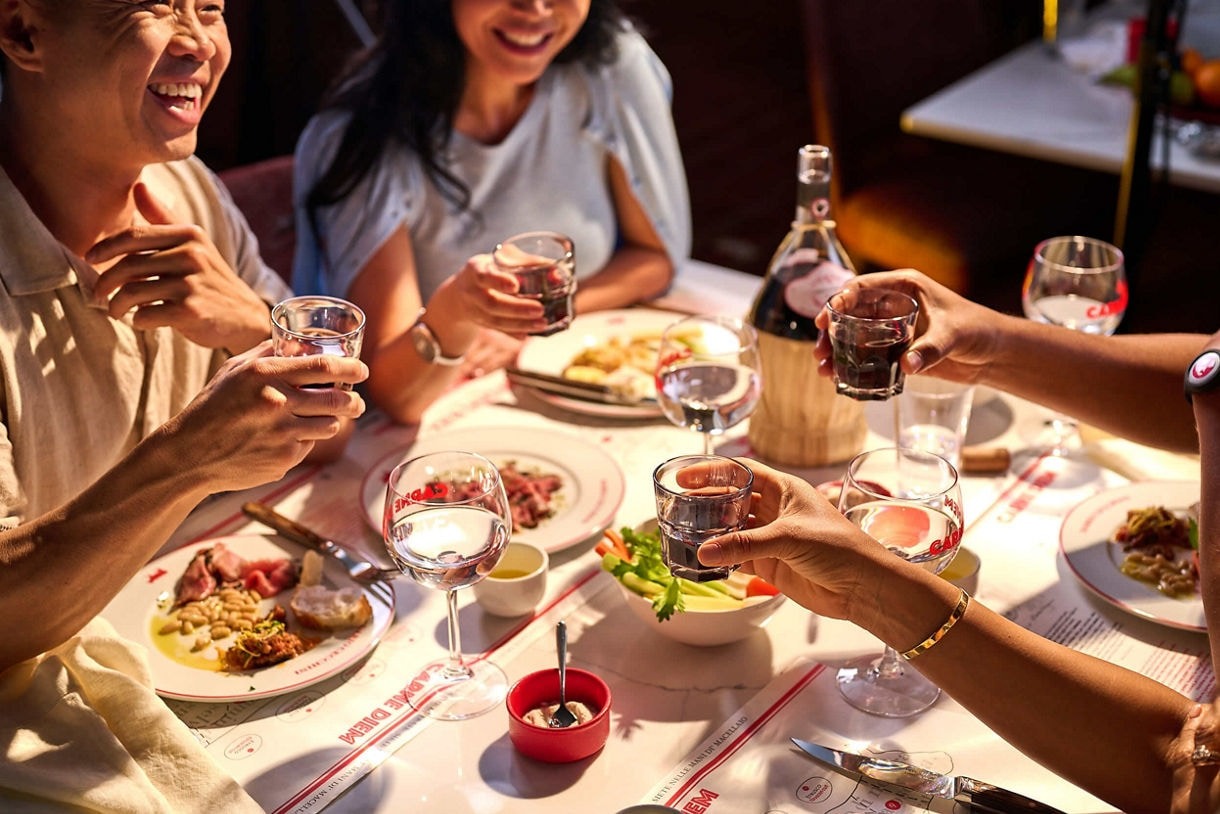 Elegant Dinner Party Aboard Princess Cruises A group of passengers enjoying an elegant dinner gathering around a white-clothed table