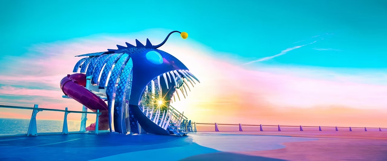 Fantastical Blue Fish Sculpture at Sunset A surreal, oversized blue fish-shaped installation with illuminated details, dramatic spiky dorsal