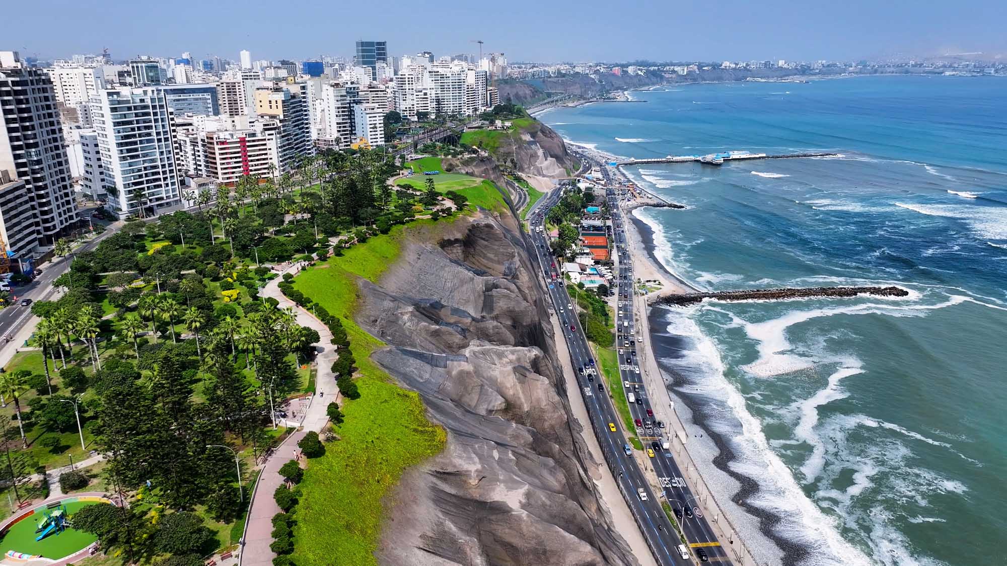 Lima Miraflores Clifftop Park and Beach Aerial view of Lima's Miraflores district featuring a verdant clifftop park overlooking the Pacific