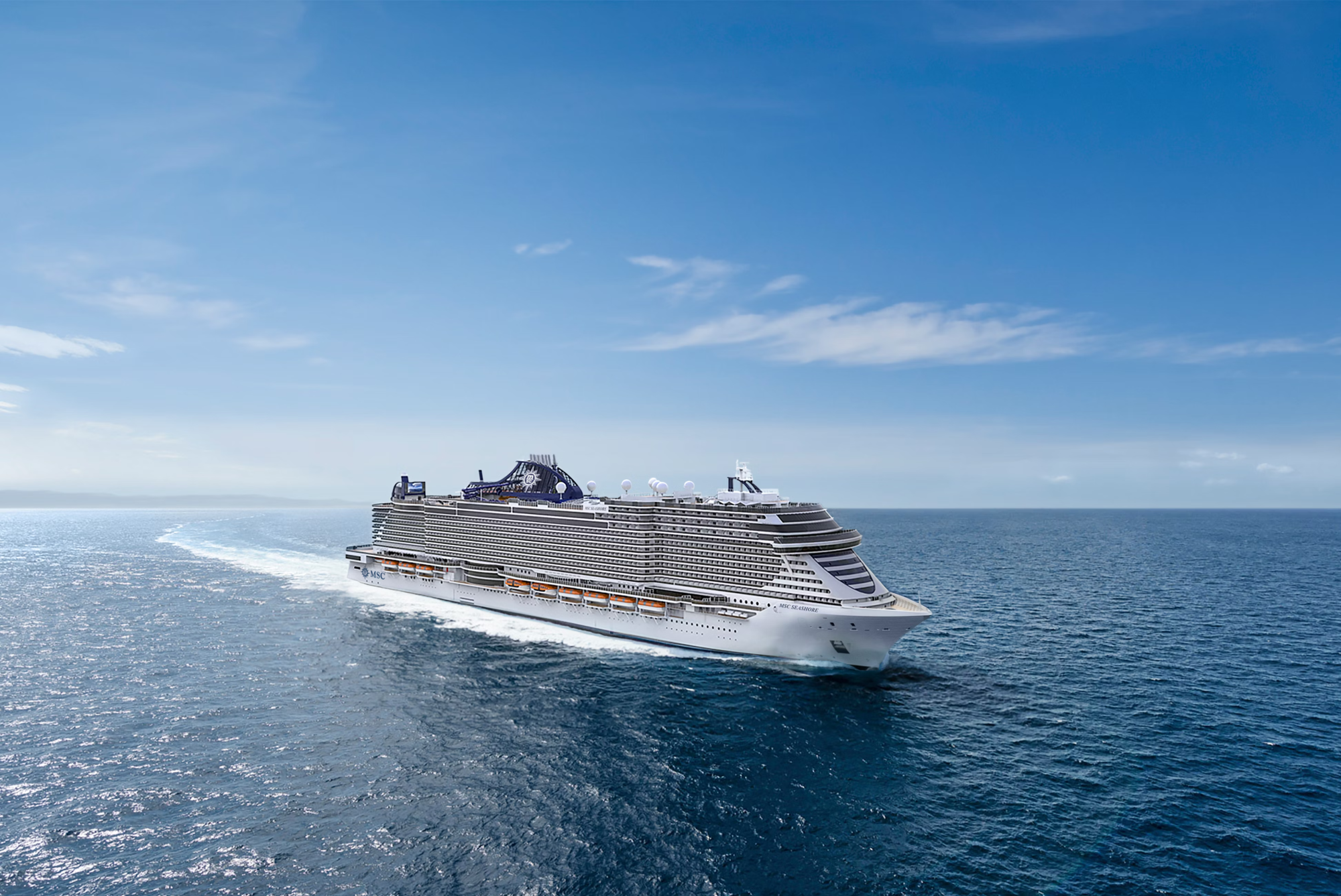 MSC Cruise Ship at Sea A large modern cruise ship from MSC Cruises sails through calm blue ocean waters under clear skies