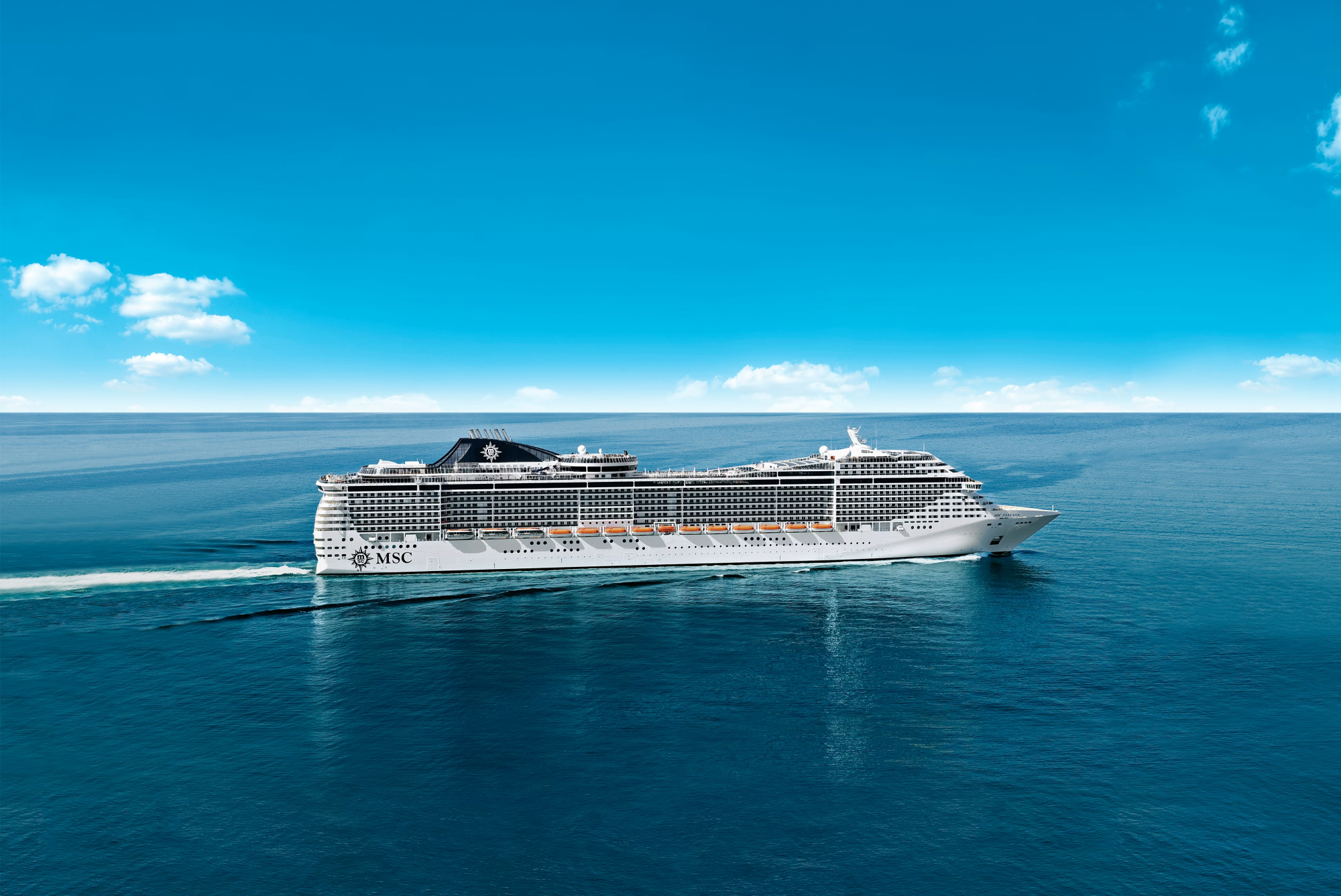 MSC Cruises Modern Ocean Liner at Sea A large modern cruise ship operated by MSC Cruises sailing on calm turquoise ocean waters under