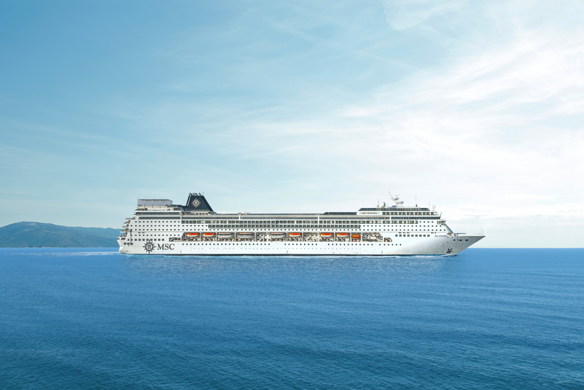 MSC Infonia Cruise Ship at Sea A large modern cruise ship operated by MSC Cruises, featuring a distinctive black funnel with