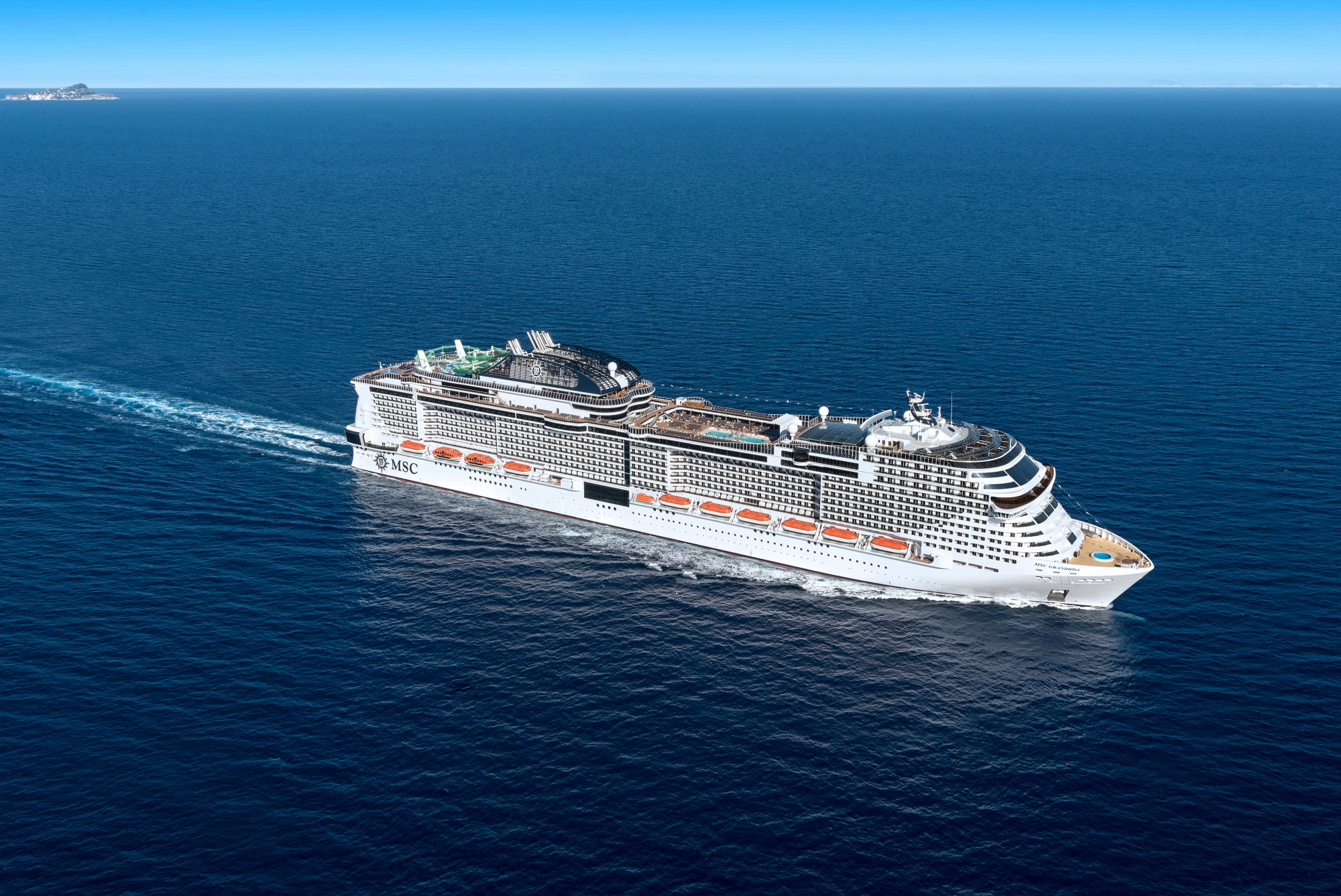 MSC Meraviglia Cruise Ship at Sea A modern mega-ship cruise vessel from MSC Cruises sailing through open ocean waters. The large