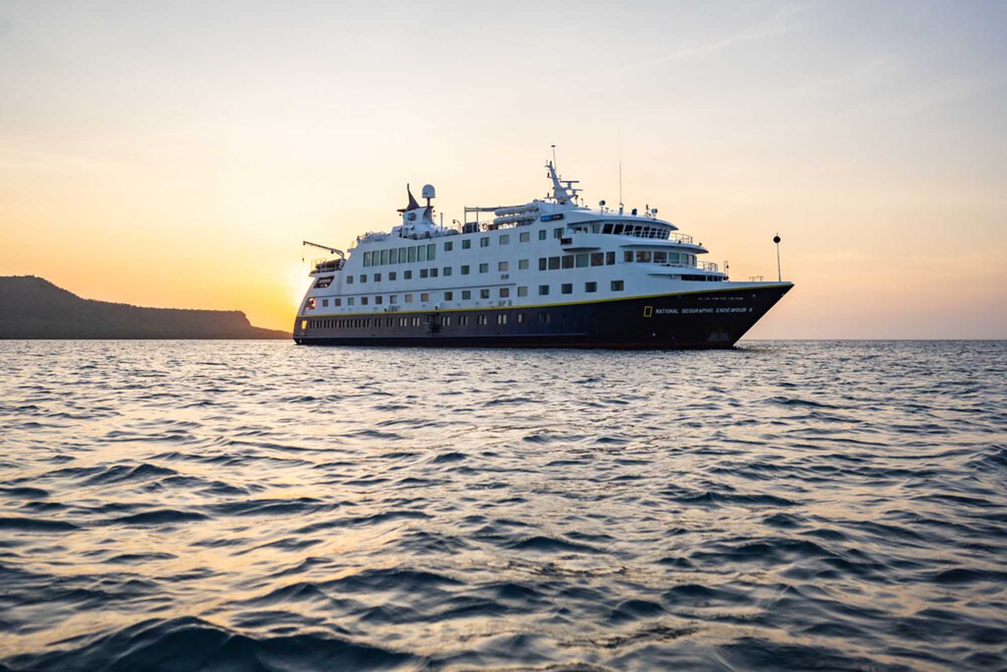 National Geographic Endeavour II at Sunset The National Geographic Endeavour II expedition cruise ship anchored offshore during golden hour