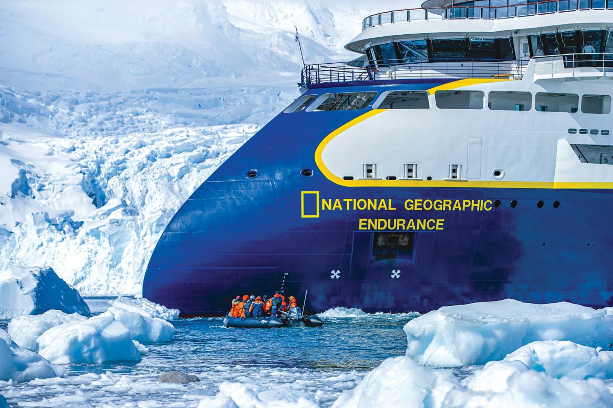 National Geographic Endurance in Antarctic Waters The National Geographic Endurance, a modern expedition cruise ship, navigates through icebergs