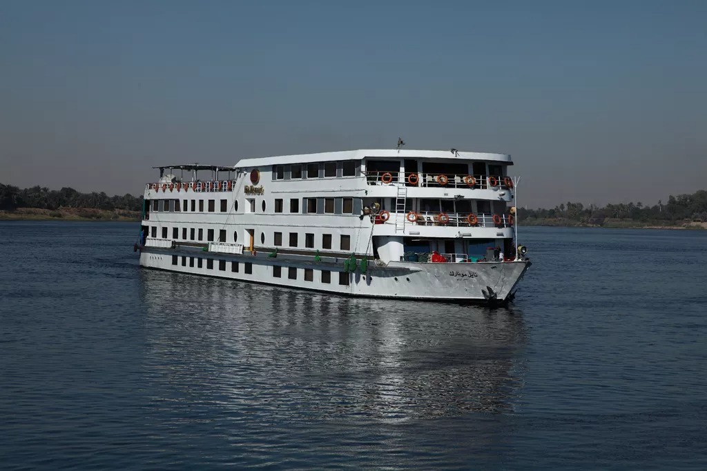 A large multi-deck river cruise ship operated by Nicko Cruises, moored on the Nile River in Egypt