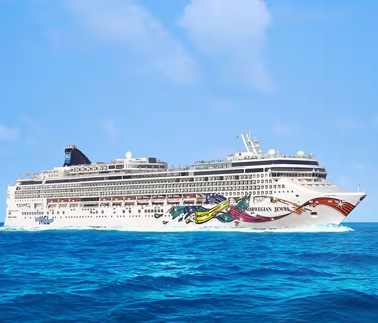 Norwegian Jewel Cruise Ship at Sea A large modern cruise ship with distinctive colorful hull artwork featuring the Norwegian Cruise
