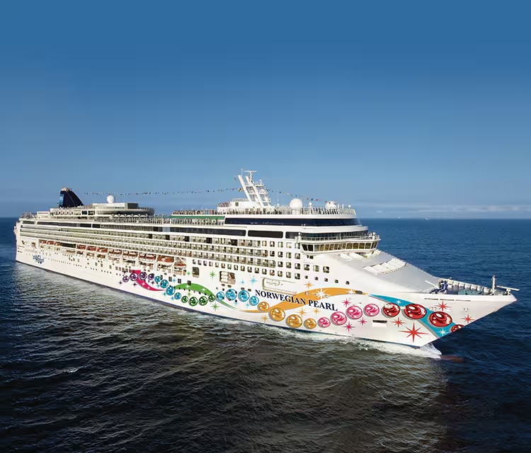 Norwegian Pearl Cruise Ship at Sea The Norwegian Pearl, a large modern cruise ship operated by Norwegian Cruise Line, sails on open