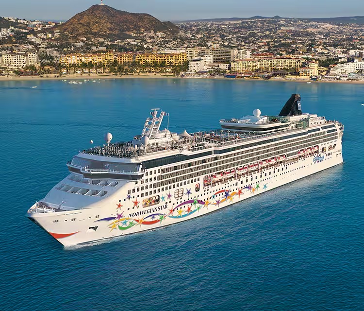 Norwegian Star Cruise Ship in Mediterranean Waters A large modern cruise ship, the Norwegian Star, anchors in brilliant turquoise Mediterranean waters