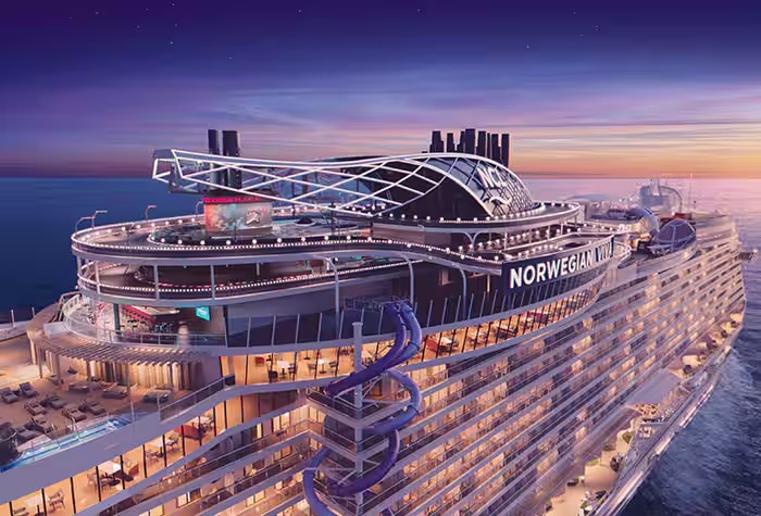 Norwegian Viva Cruise Ship at Sunset A stunning aerial view of the Norwegian Viva cruise ship illuminated during golden hour, showcasing