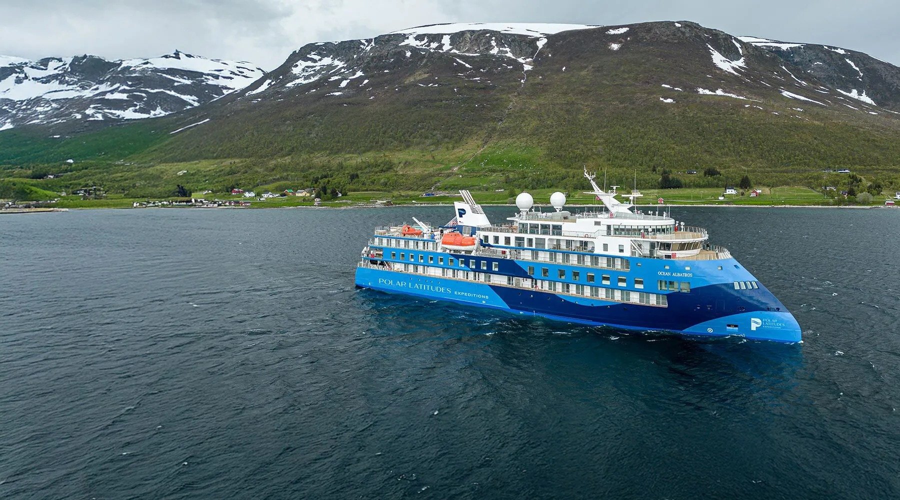 The Ocean Adventurer, a blue and white expedition cruise ship operated by Polar Latitudes
