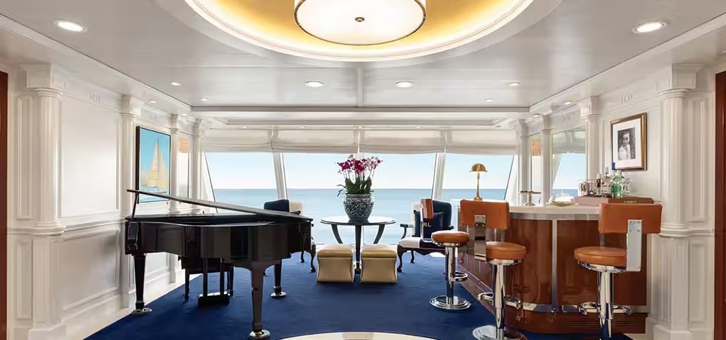 Oceania Cruises O-Class Owner Suite with Ocean View A luxurious owner suite aboard an Oceania Cruises O-Class ship, featuring a black grand piano