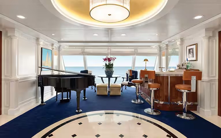 Oceania Cruises O-Class Owner Suite with Ocean View A luxurious owner suite aboard an Oceania Cruises O-Class ship, featuring a grand piano, elegant