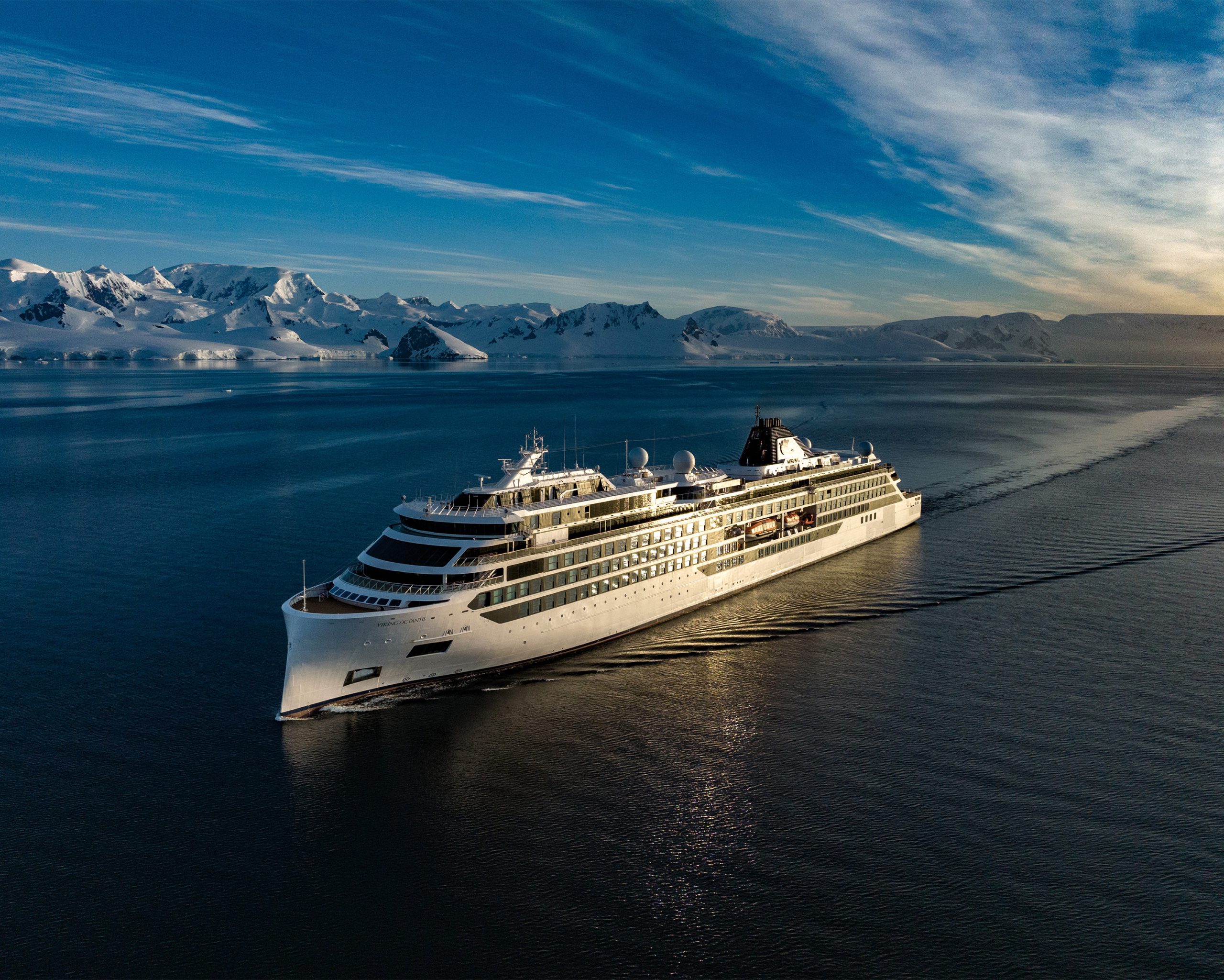 Octantis Expedition Ship in Antarctic Waters The Octantis, a luxury expedition cruise ship, navigates pristine Antarctic waters with snow-capped
