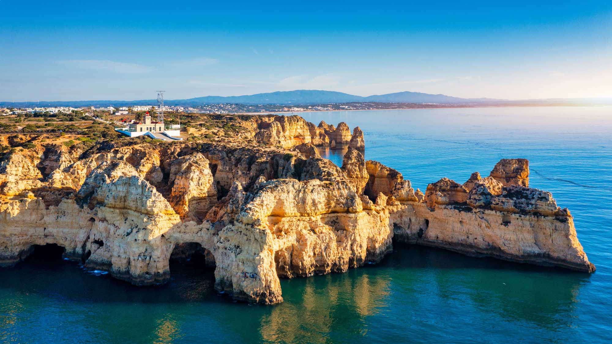 Ponta da Piedade Golden Cliffs, Algarve A stunning panoramic view of Ponta da Piedade near Lagos in Portugal's Algarve region, featuring
