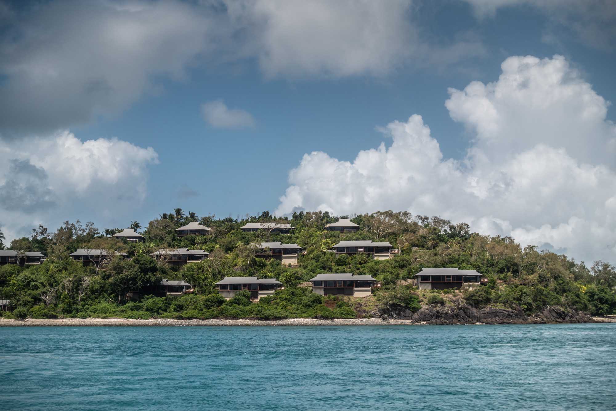 Qualia Resort Villas on Hamilton Island Luxury beachfront villas of Qualia Resort cascade down a lush, tree-covered hillside overlooking