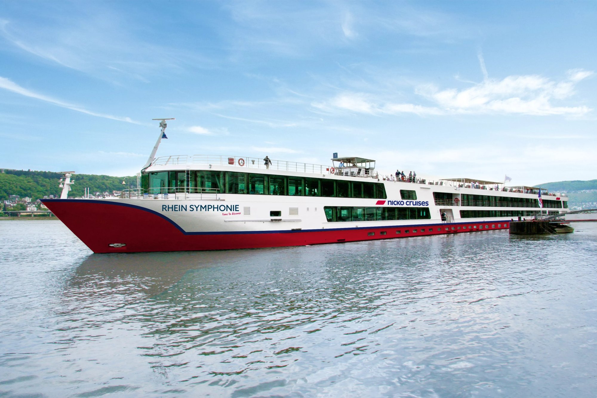 The Rhein Symphonie, a modern river cruise ship operated by Nicko Cruises, is moored on the Rhine