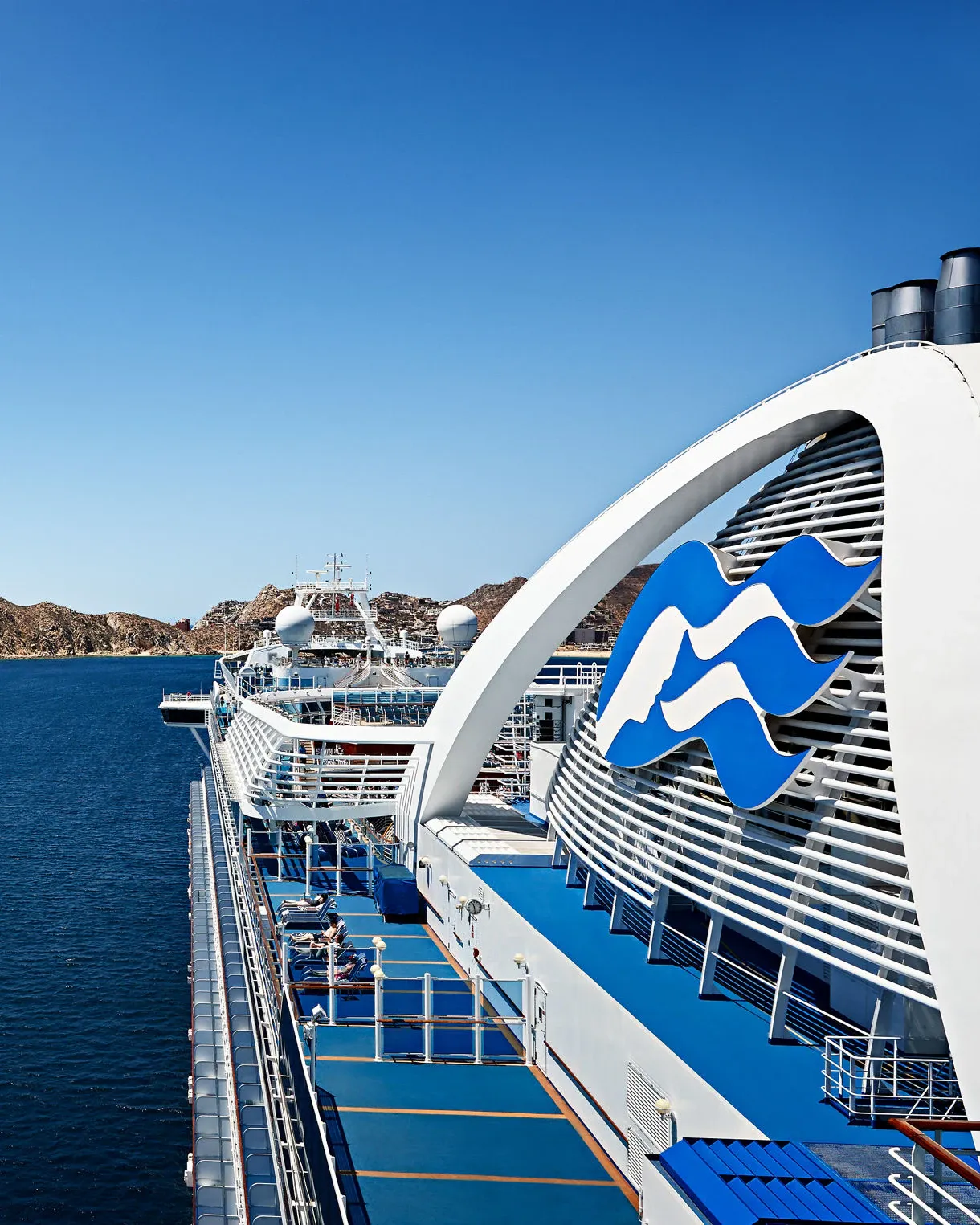 Ruby Princess Docked at Los Arcos, Mexico A striking side view of the Ruby Princess cruise ship docked in crystal-clear blue waters near Los