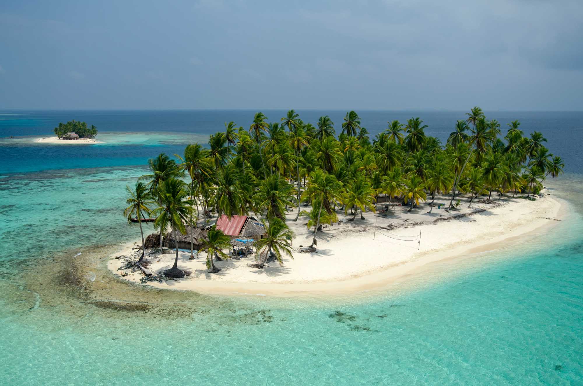 San Blas Islands Aerial View with Palm Trees An aerial photograph of a pristine tropical island in the San Blas archipelago, Panama, featuring
