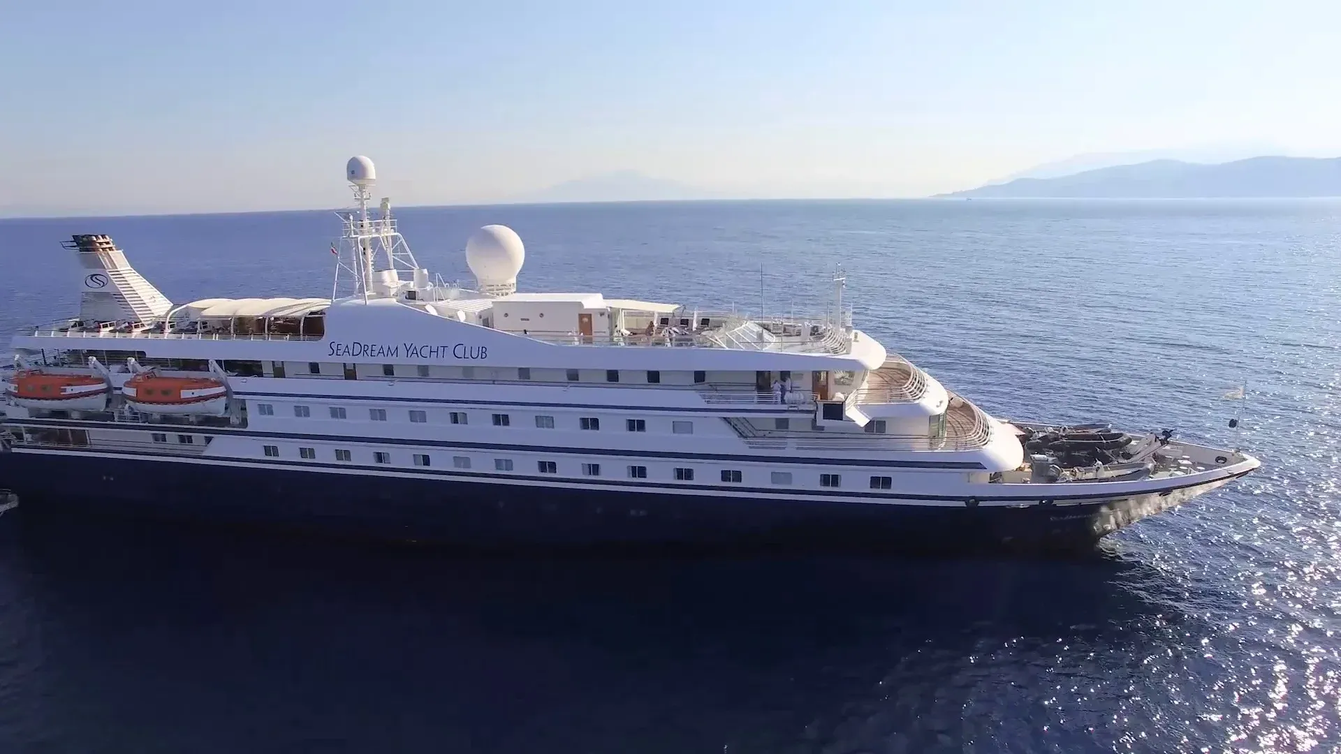 SeaDream Yacht Club Anchored in Mediterranean Waters The luxury expedition yacht SeaDream Yacht Club is anchored in calm Mediterranean waters